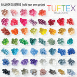 Colorful balloon clusters arranged in rows with 'Tuftex Balloons' branding.