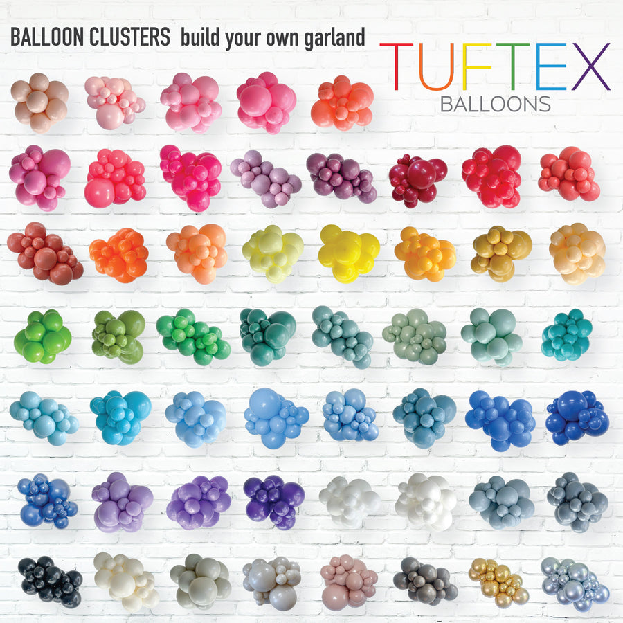 Colorful balloon clusters arranged in rows with 'Tuftex Balloons' branding.